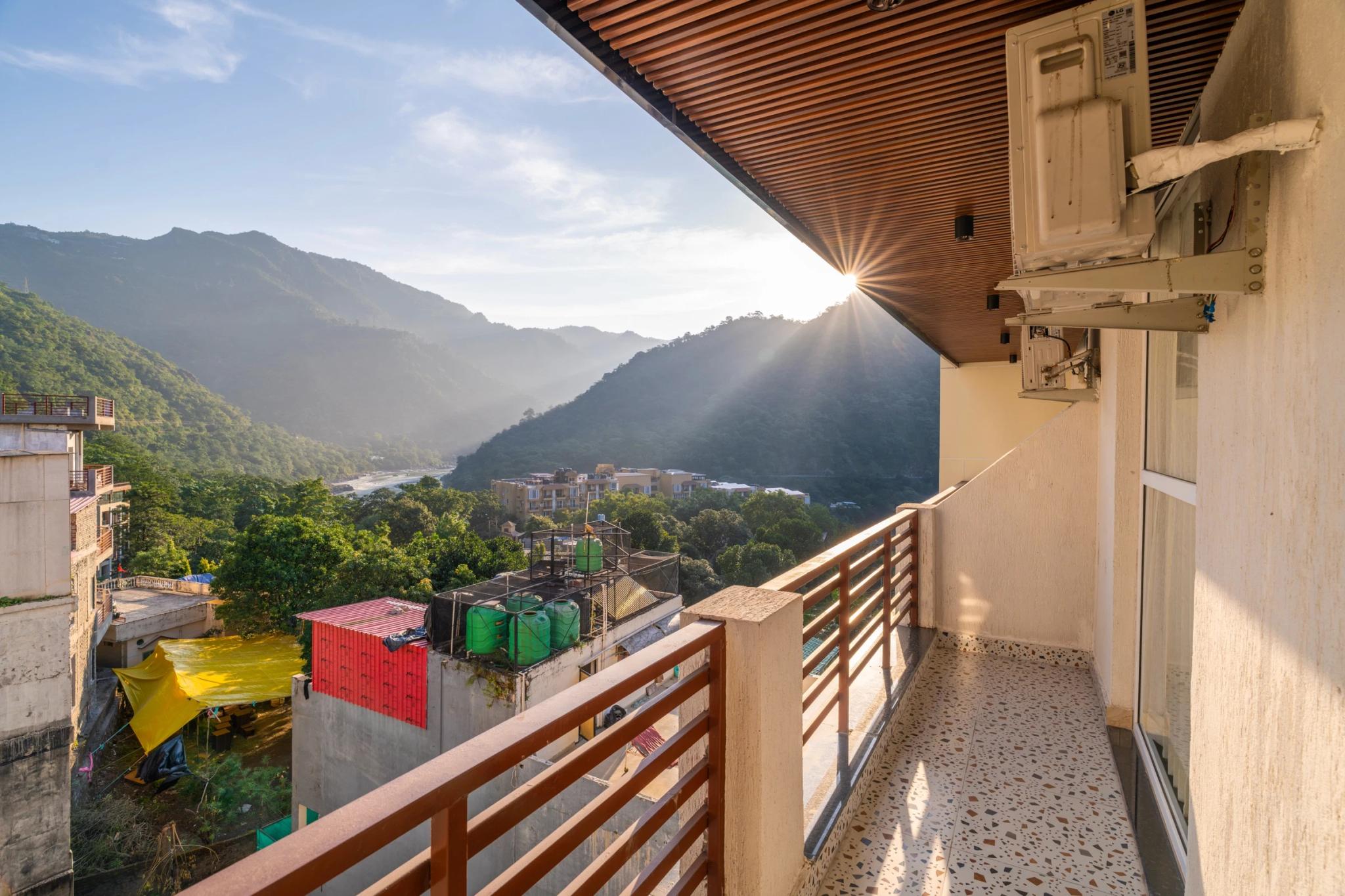 Sun setting over the valley, seen from a room balcony
