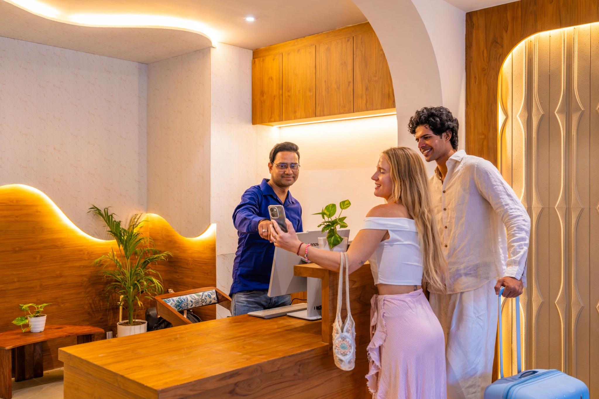 FRAZ team member welcoming guests at the reception desk