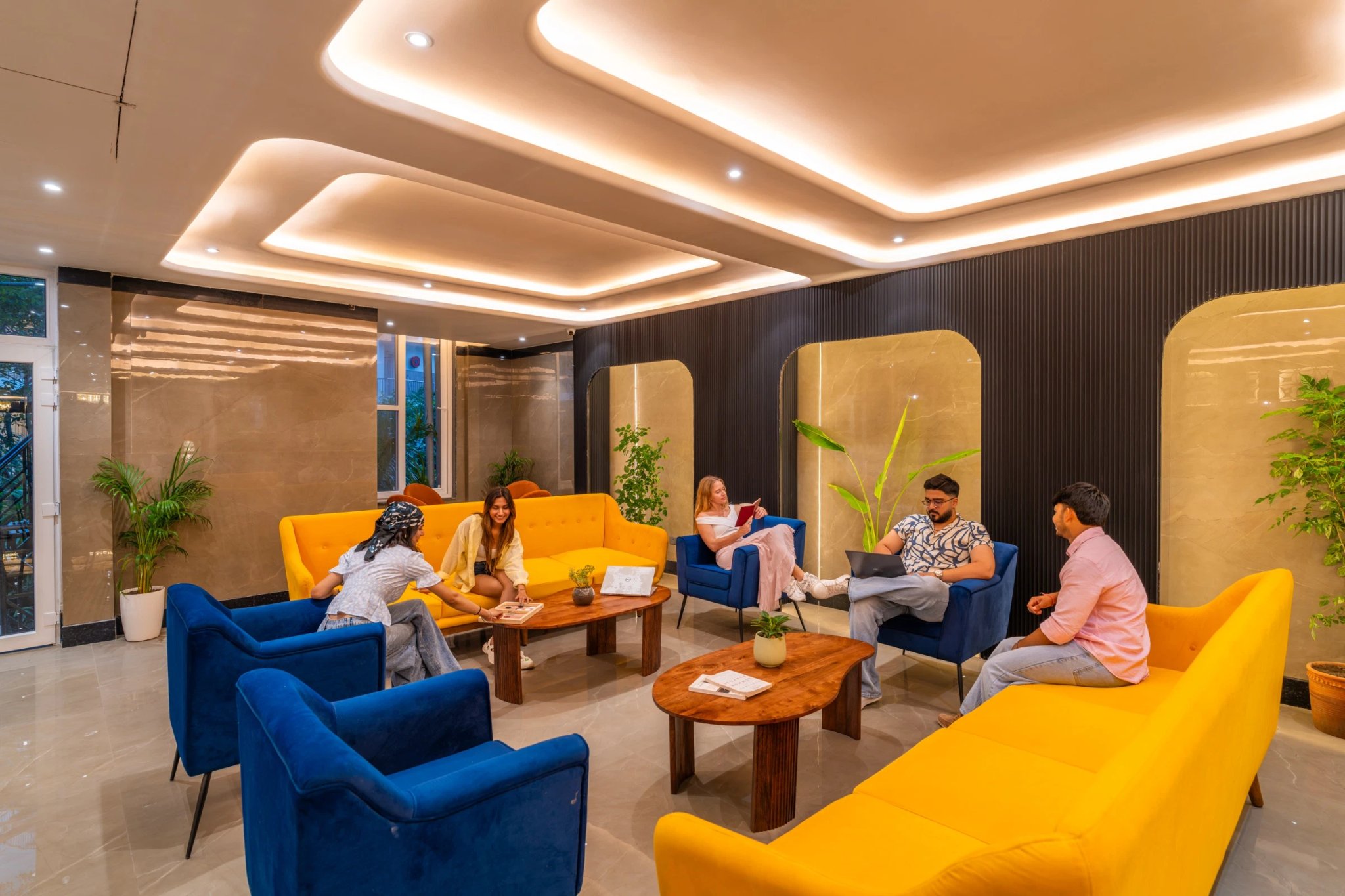 Guests chatting over coffee in the lounge